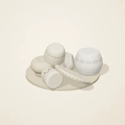 The six parts of Ivory Moon No. 4 in a loose pile on a round stand