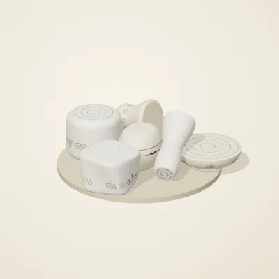 The six parts of Ivory Moon No. 23 in a loose pile on a round stand