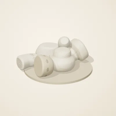 The six parts of Ivory Moon No. 26 in a loose pile on a round stand