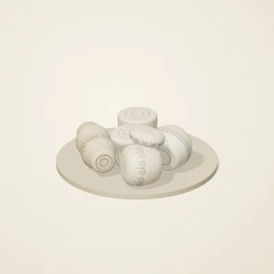 The six parts of Ivory Moon No. 40 in a loose pile on a round stand